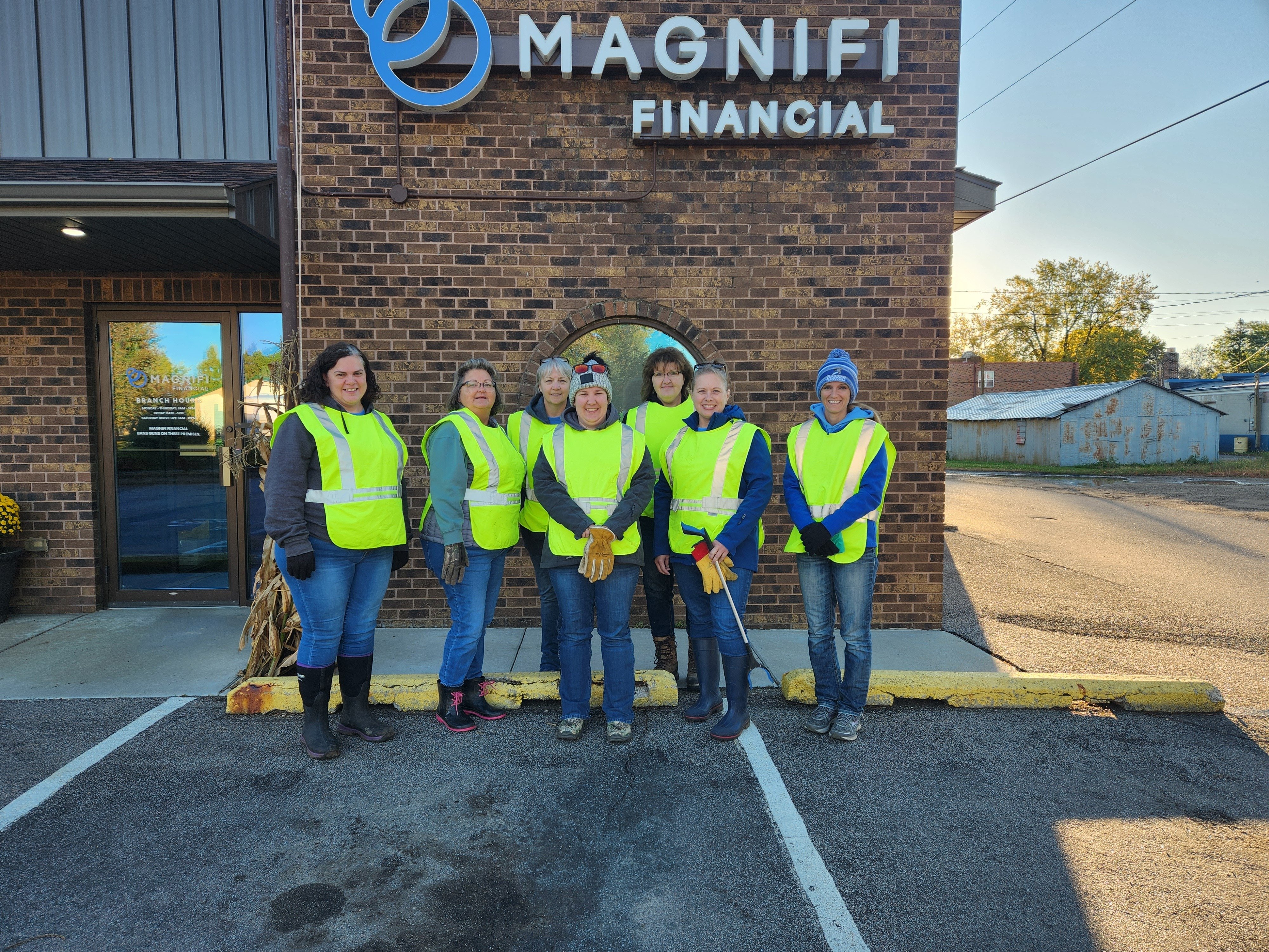 Magnifi team members happily volunteering.
