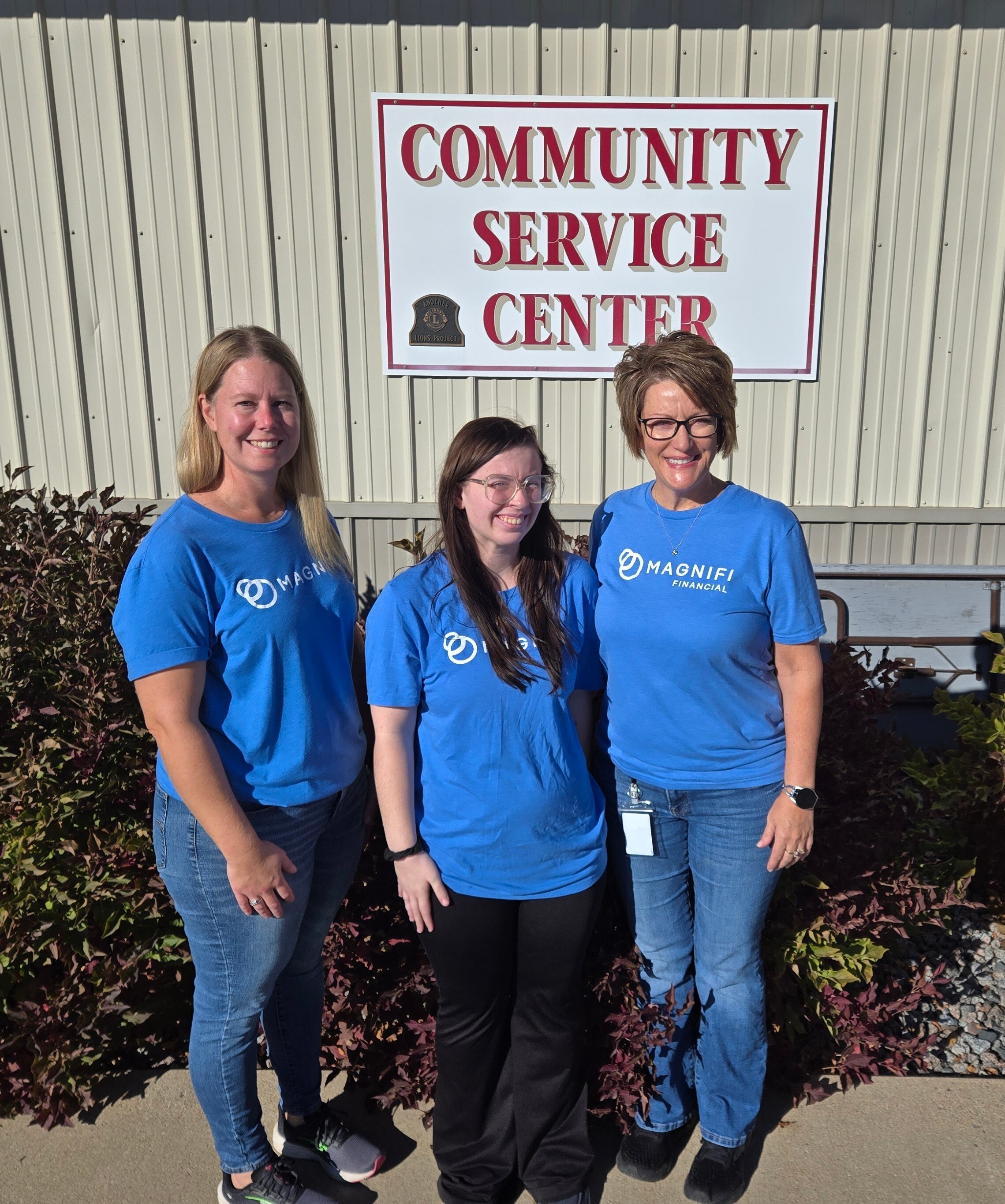 Magnifi team members happily volunteering.