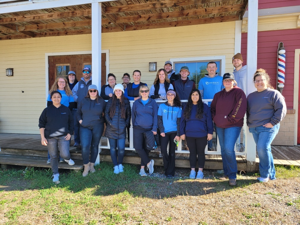 Magnifi team members happily volunteering.