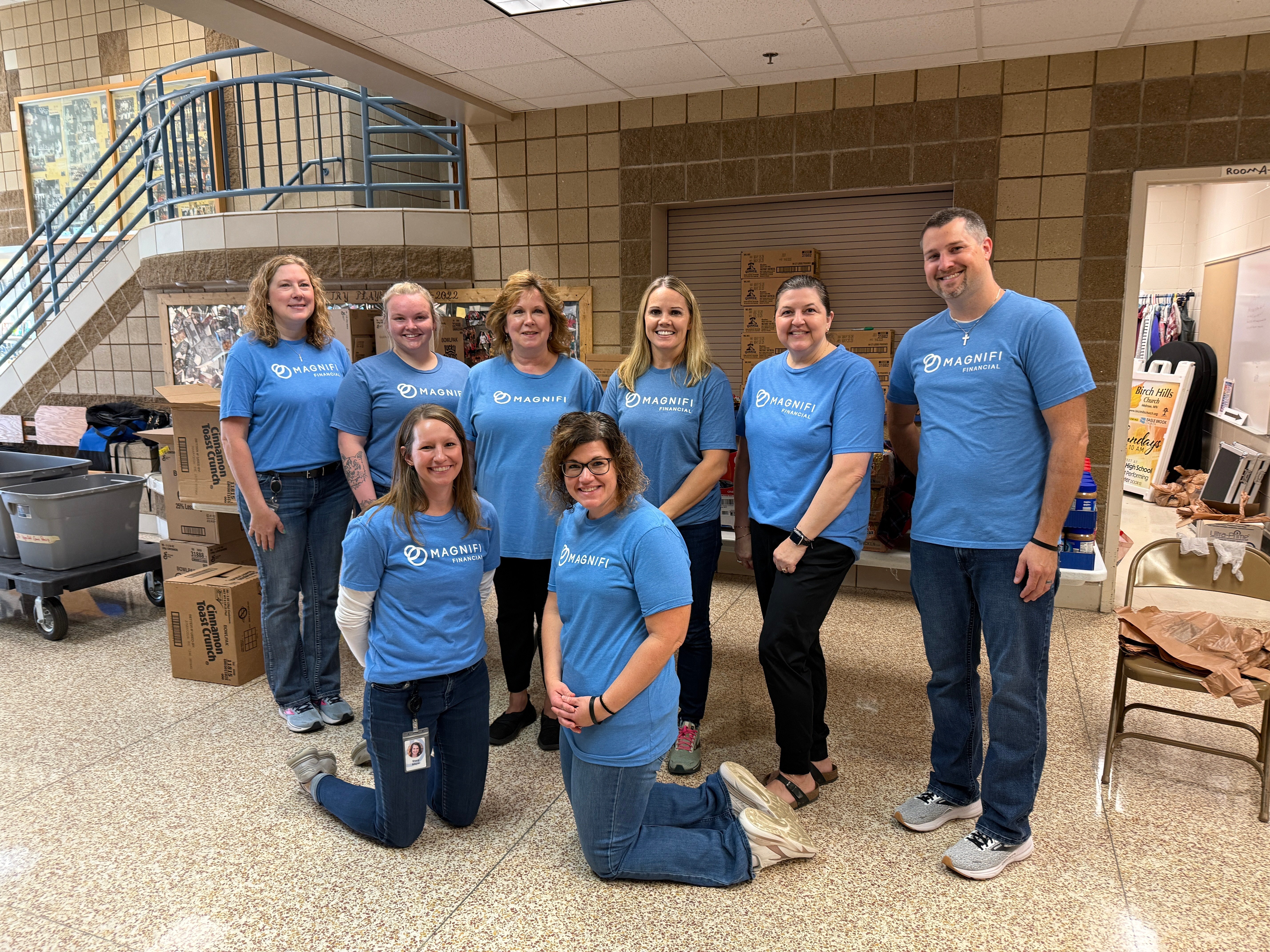 Magnifi team members happily volunteering.