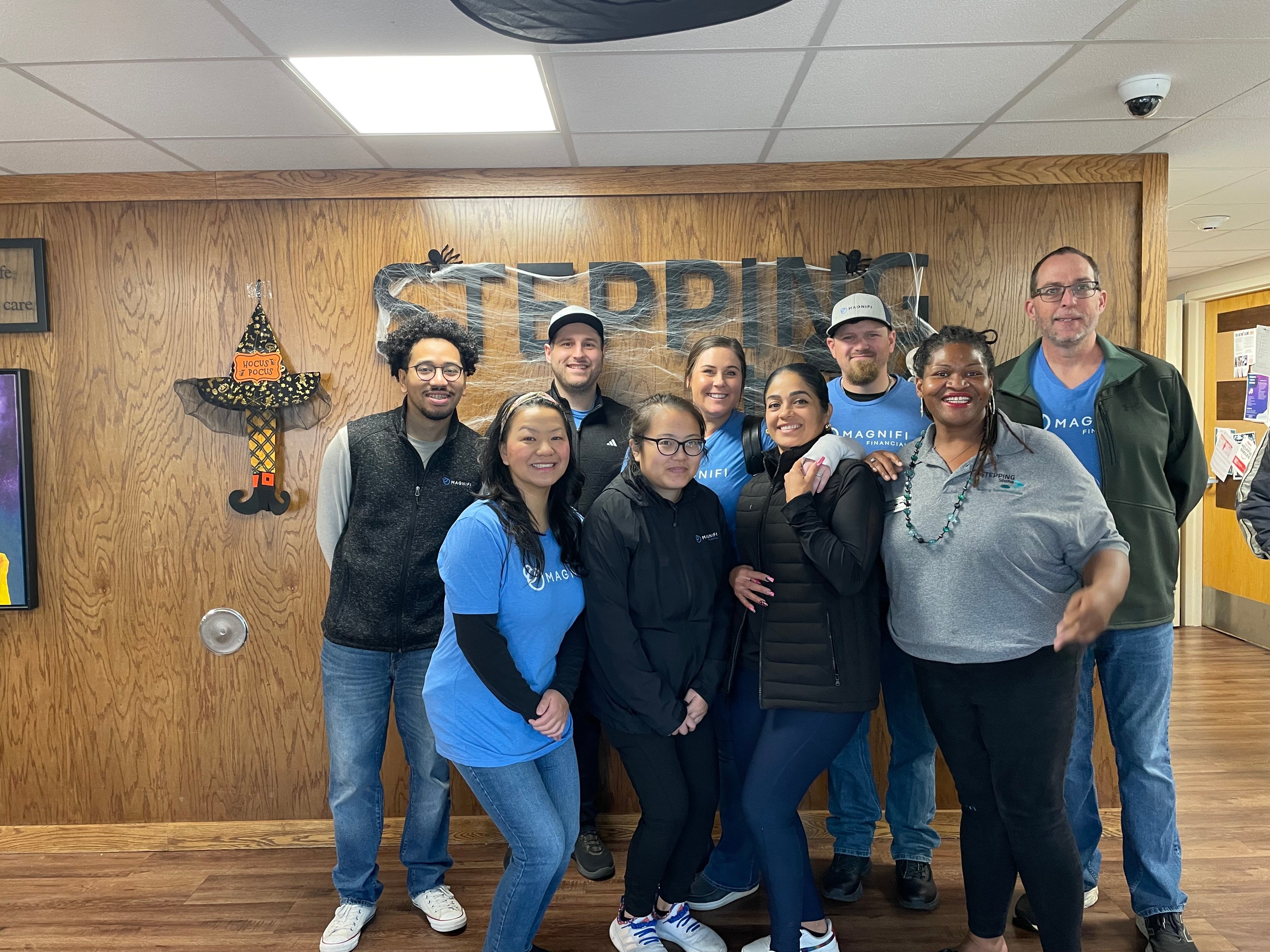 Magnifi team members happily volunteering.