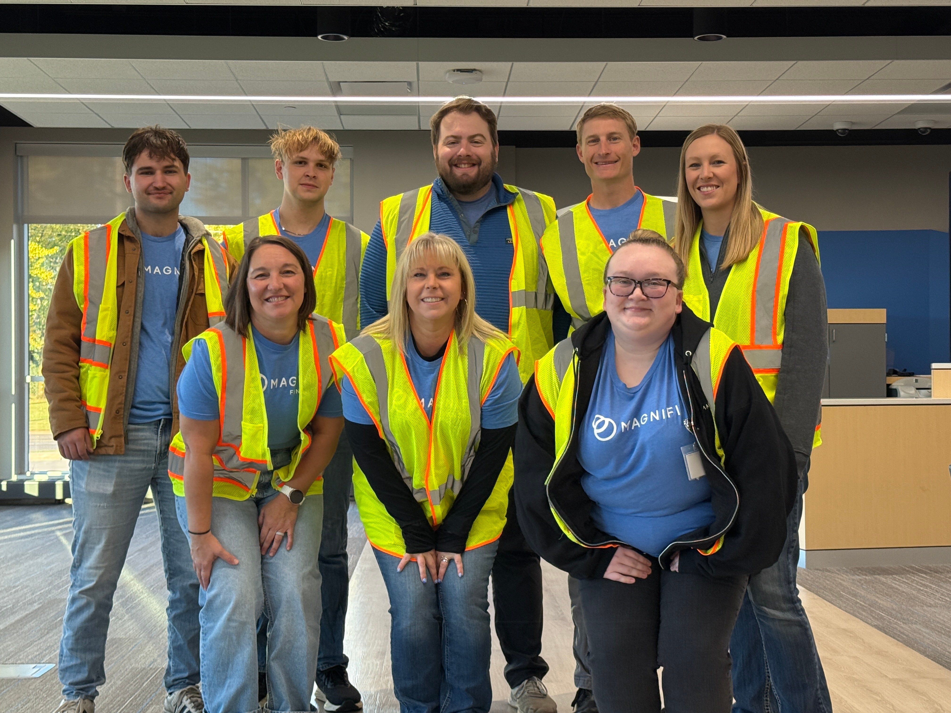 Magnifi team members happily volunteering.