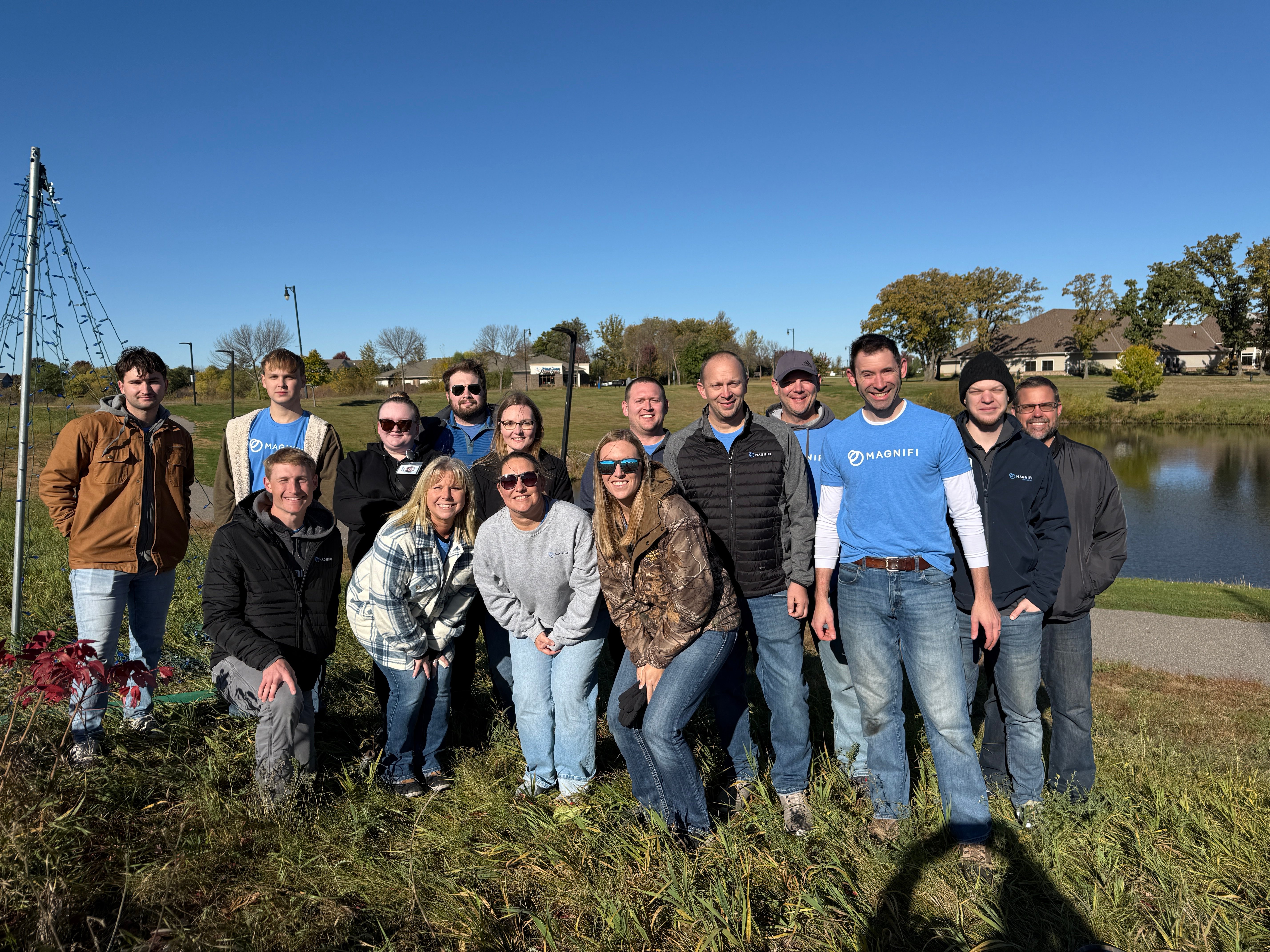 Magnifi team members happily volunteering.