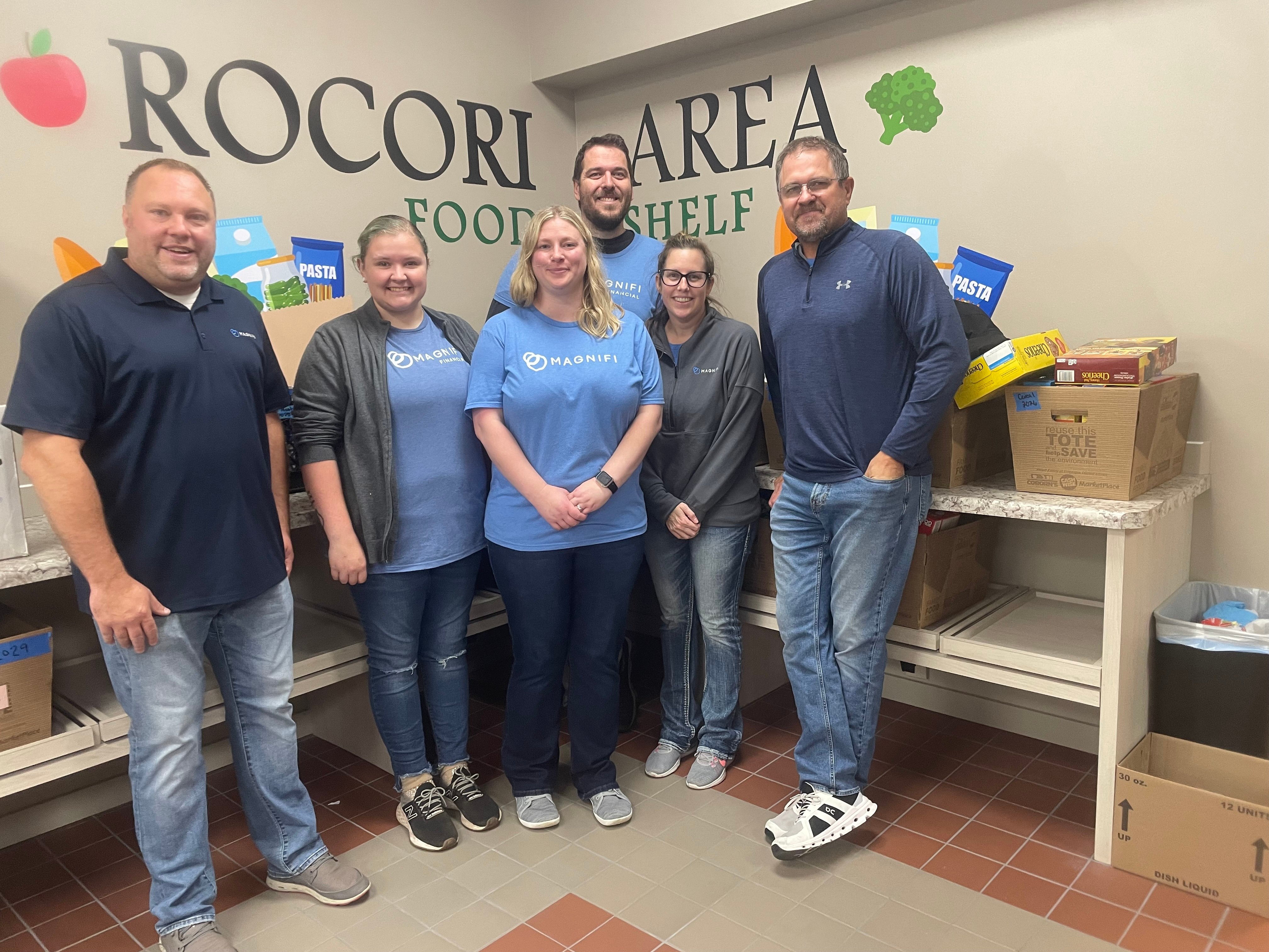 Magnifi team members happily volunteering.
