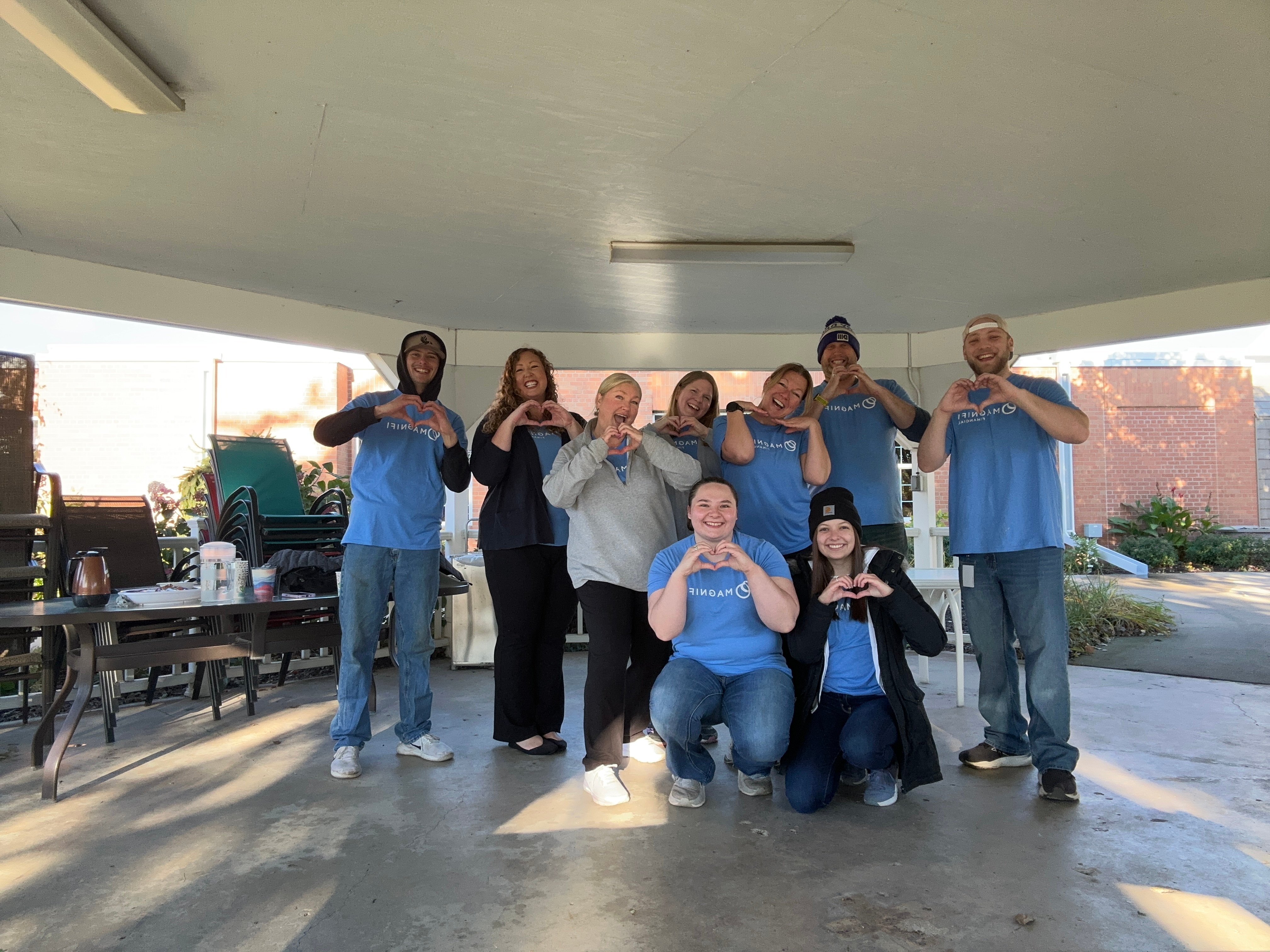 Magnifi team members happily volunteering.