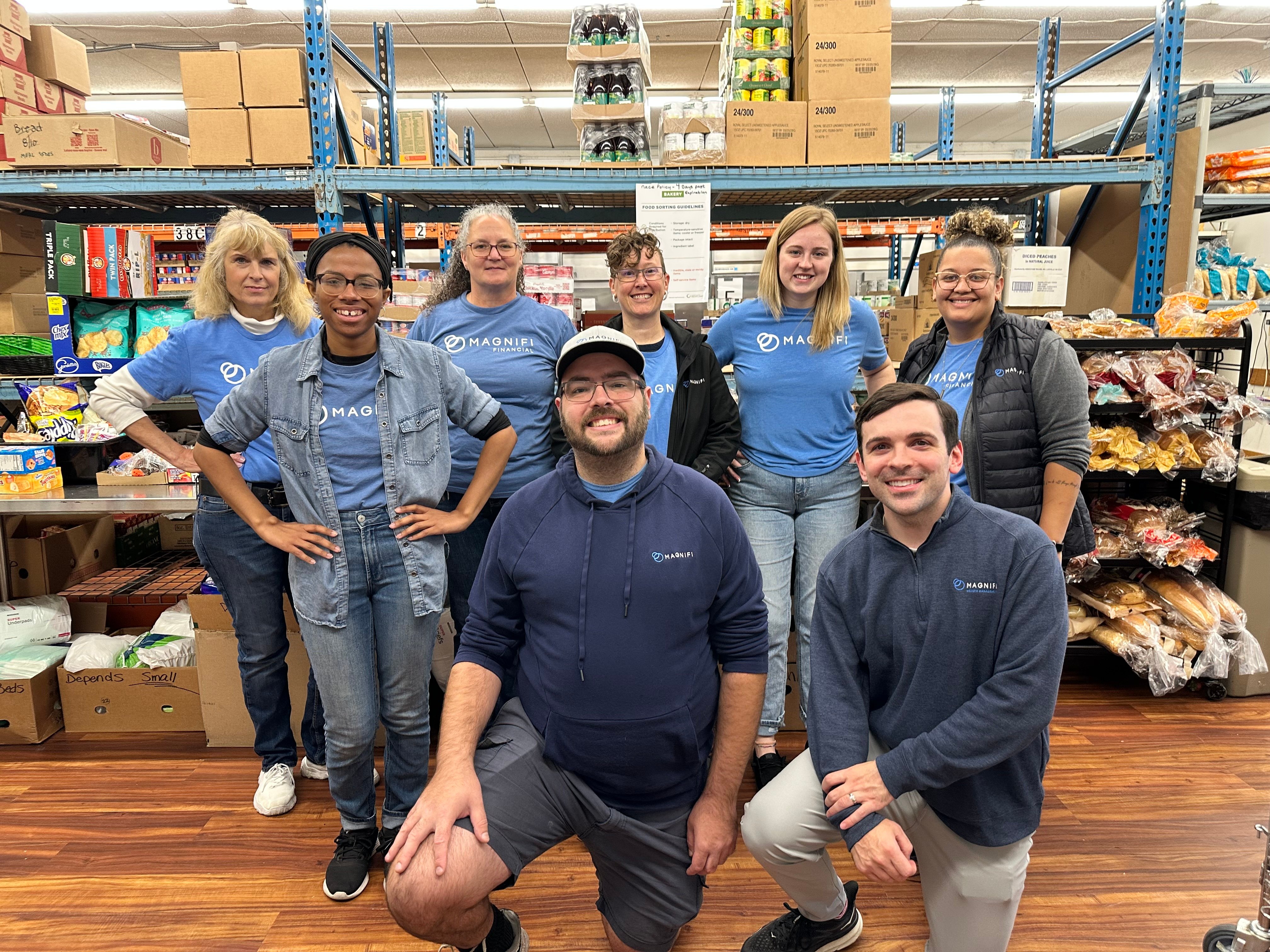 Magnifi team members happily volunteering.