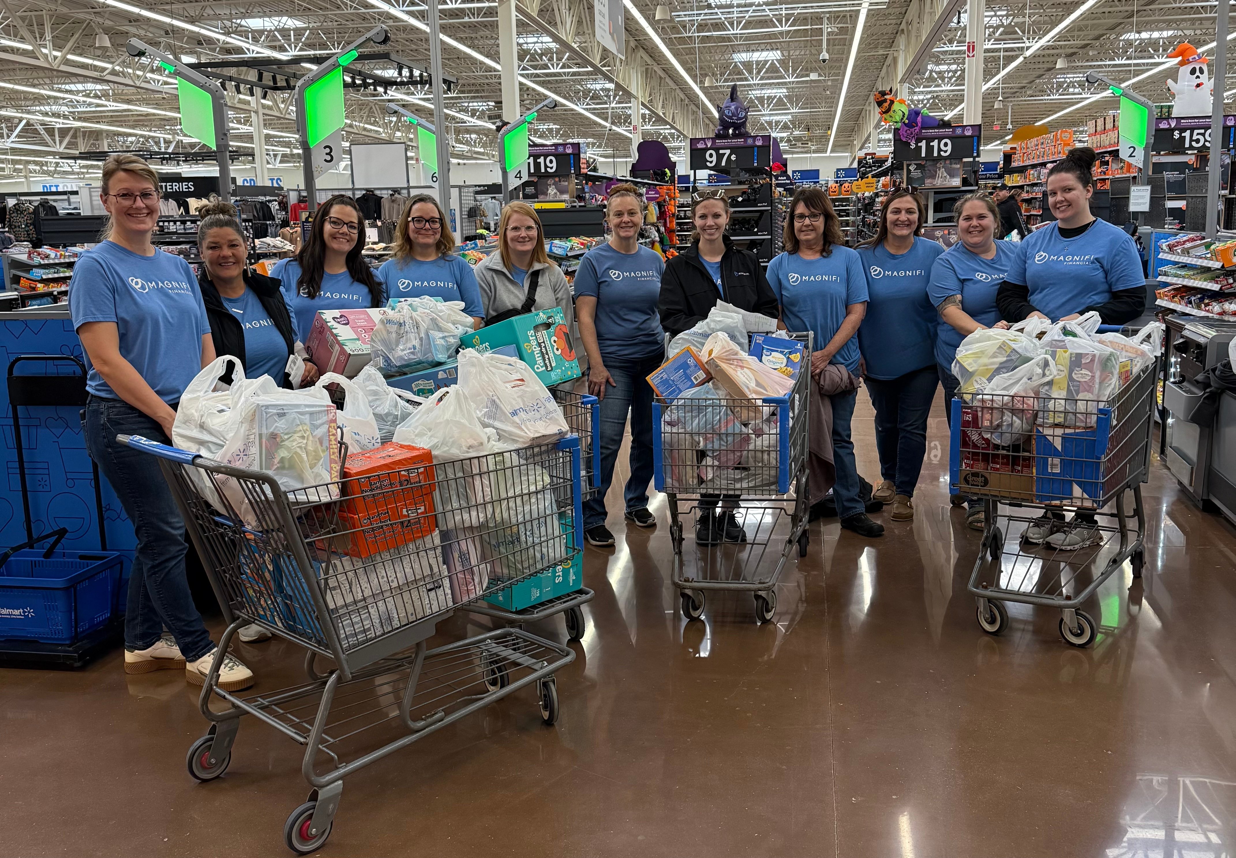Magnifi team members happily volunteering.