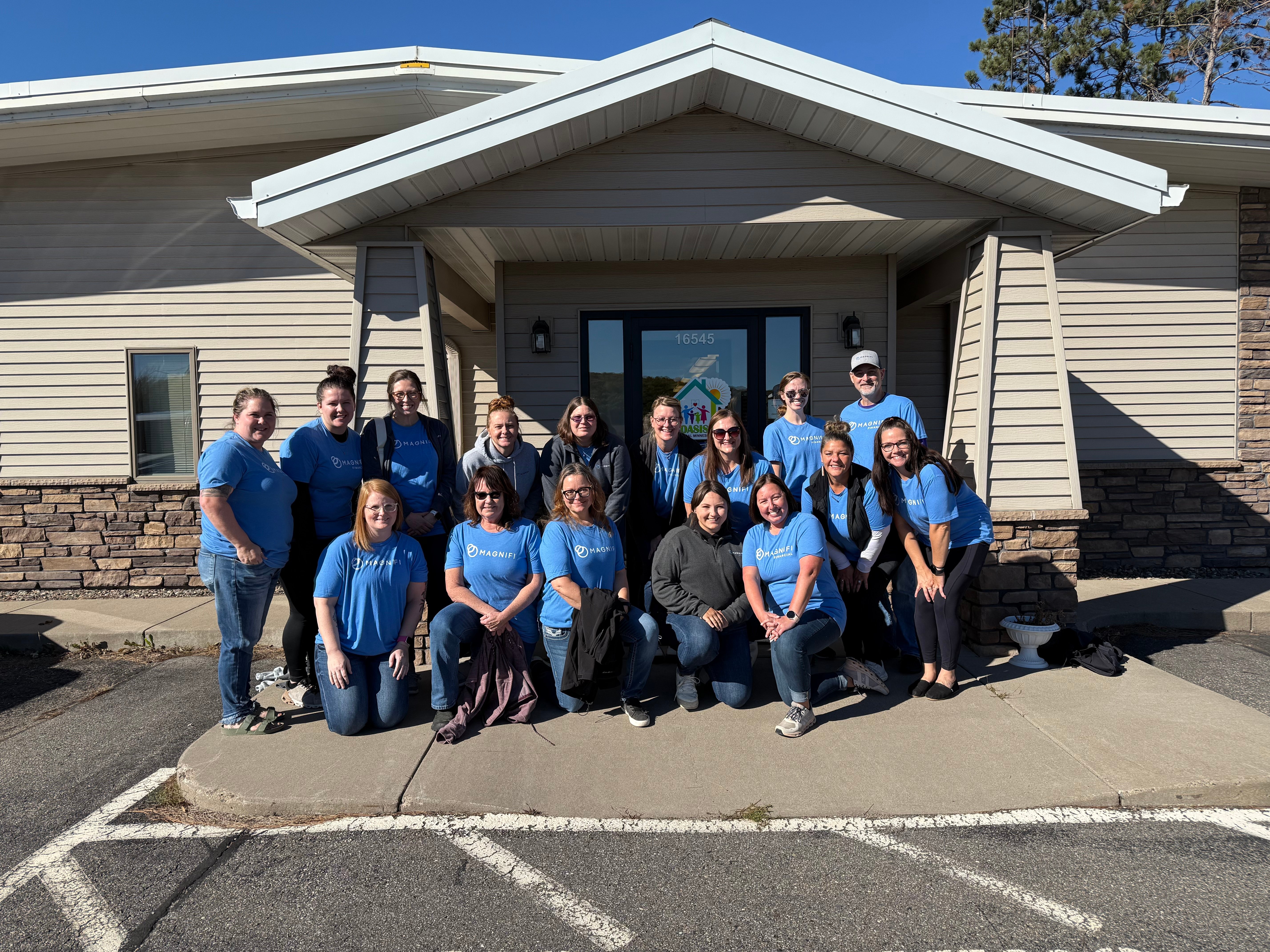 Magnifi team members happily volunteering.