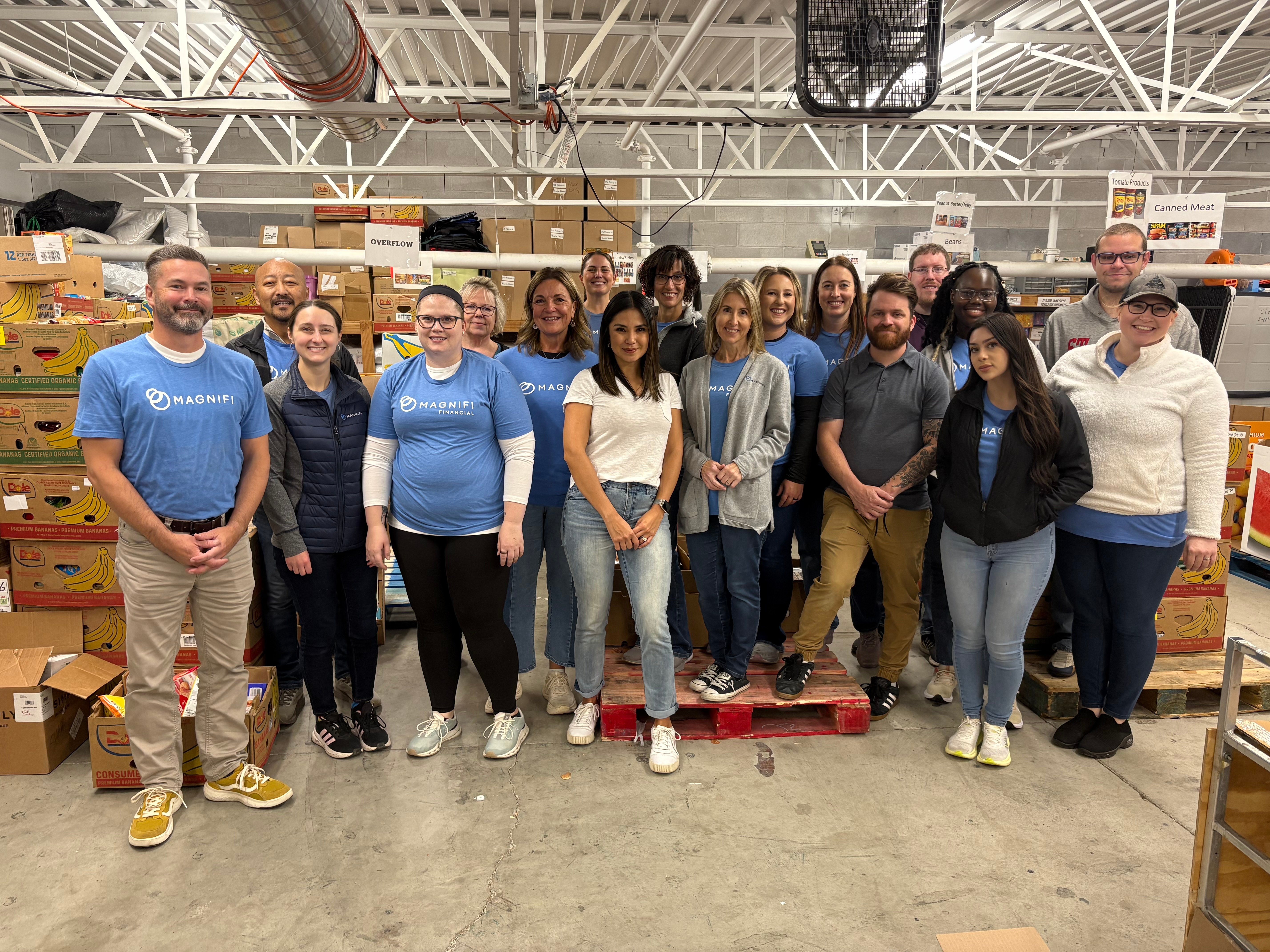 Magnifi team members happily volunteering.