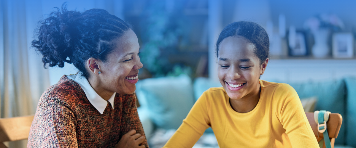 Parent talking with child about college scams and fraud prevention